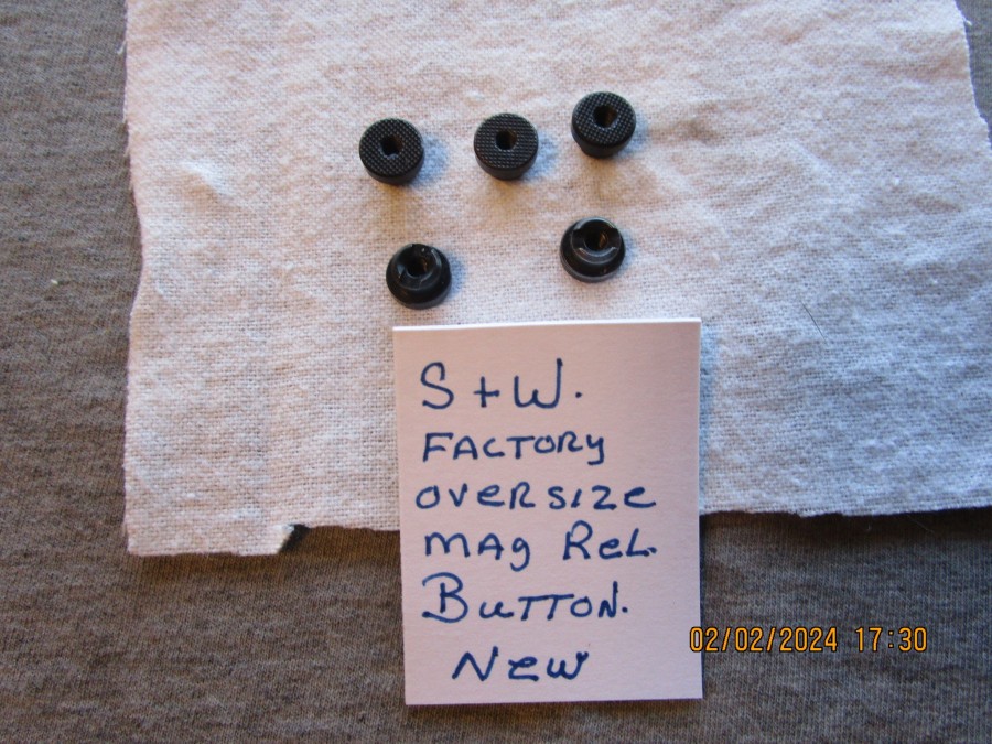 Smith & Wesson factory over size mag release button. , Guns N Parts West Springfield, MA.